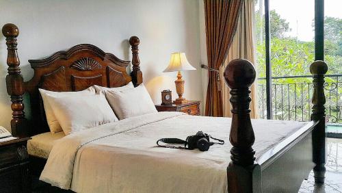 Кровать или кровати в номере Sarasvati Borobudur