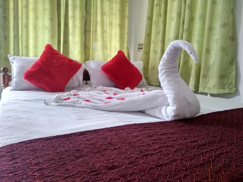 Ένα ή περισσότερα κρεβάτια σε δωμάτιο στο Blue Birds Homestay