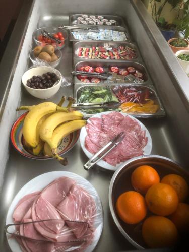 a refrigerator filled with lots of different types of food at Willa chez willi in Niederschaeffolsheim