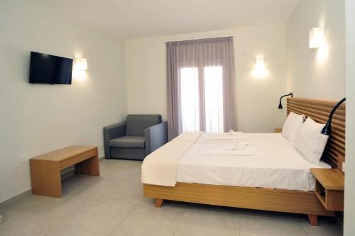 Ένα ή περισσότερα κρεβάτια σε δωμάτιο στο Mithos Premium Rooms