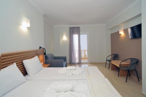 Ένα ή περισσότερα κρεβάτια σε δωμάτιο στο Mithos Premium Rooms