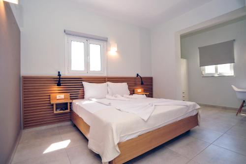 Ένα ή περισσότερα κρεβάτια σε δωμάτιο στο Mithos Premium Rooms