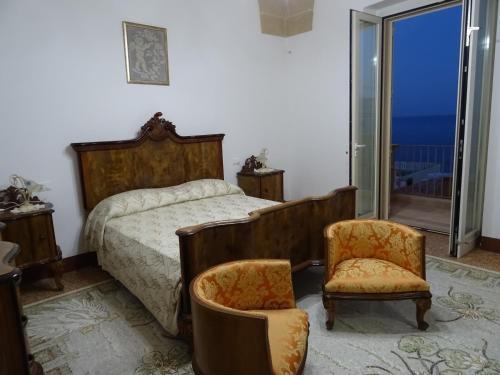Llit o llits en una habitació de Dimora Rizzo con tappeti di pietra