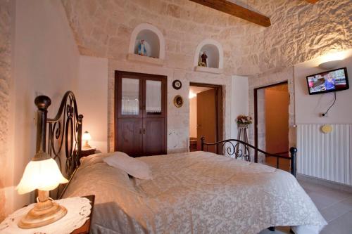 Postel nebo postele na pokoji v ubytování B&B Salita Delle Pere