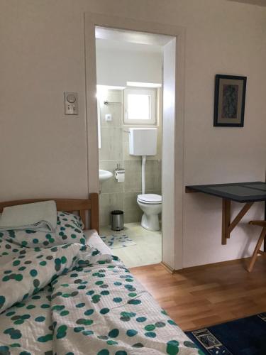 Postel nebo postele na pokoji v ubytování Apartmani Stojanovic