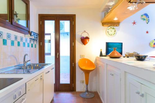 a kitchen with a sink and a counter top at Villa Madreperla in Marciana