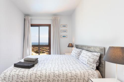 Posteľ alebo postele v izbe v ubytovaní Home2Book Amazing Sea View El Médano Pool & Wifi