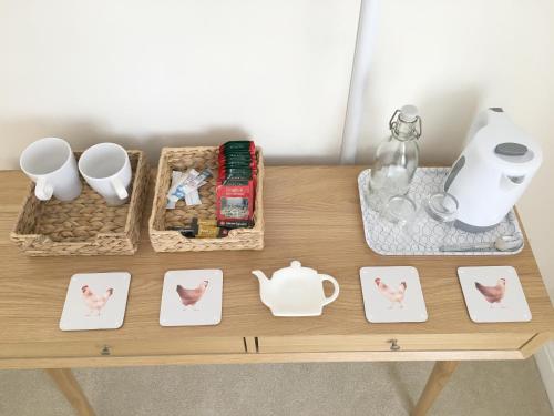 a table with various items on top of it at 1 Ashford Road Guesthouse in Redhill