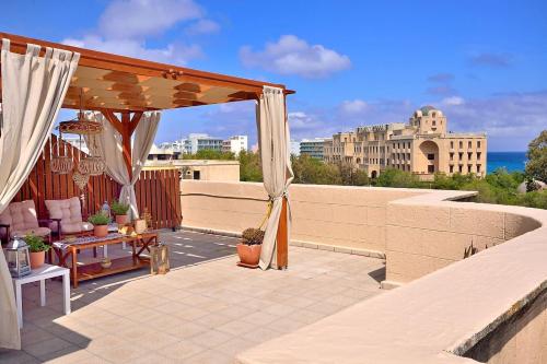 a patio with a gazebo on a roof at CENTER Penthouse - MEDIEVAL Town 10'- BEACH 2' in Rhodes Town