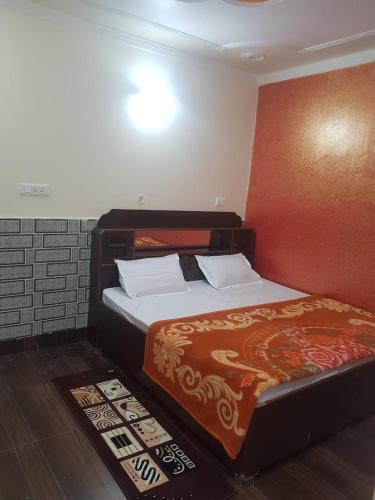 Postel nebo postele na pokoji v ubytování Hill dew homestay