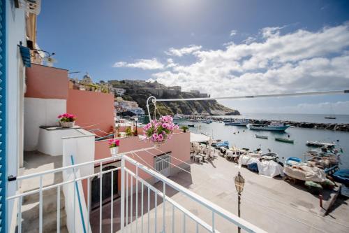 a balcony view of a harbor with boats in the water at Casa Athina in Procida