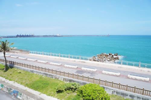 an aerial view of a road next to the ocean at 36 Lighthouse in Hualien City