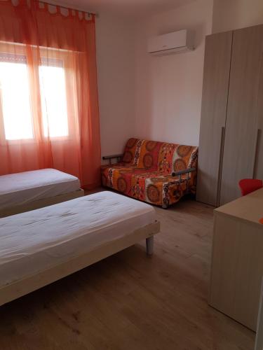 Ένα ή περισσότερα κρεβάτια σε δωμάτιο στο La Casa di Nico