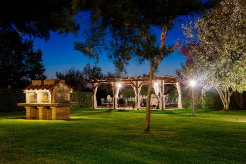 a gazebo in a yard at night at Villa Aia Vecchia in Bibbona