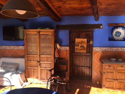 TV a/nebo společenská místnost v ubytování Casa rural De Añil - Jardín privado