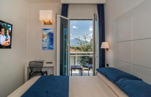Postel nebo postele na pokoji v ubytování Hotel Central Park