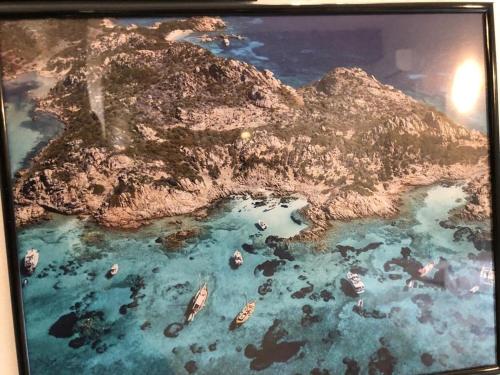 a model of a island with boats in the water at Appartamenti Milù - Milù Holidays in La Maddalena