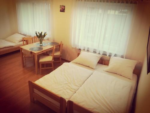 A bed or beds in a room at Morska Fala