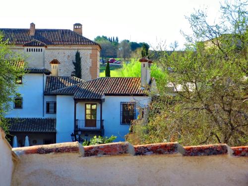 a view of a blue house from a wall at Casa del Hortelano in Chinchón