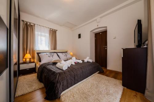 Posteľ alebo postele v izbe v ubytovaní Central Apartment Castle Cippico