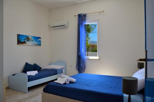 Postel nebo postele na pokoji v ubytování Villa con piscina Alcamo Marina