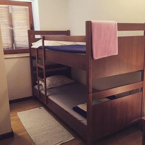 a couple of bunk beds in a room at Buffet M Apartments and Rooms Obrovac in Obrovac