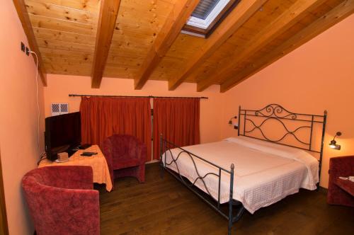 מיטה או מיטות בחדר ב-Agriturismo I Marzemini