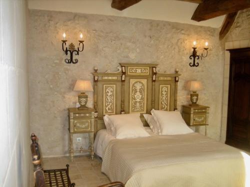 Säng eller sängar i ett rum på la Chambre des Dames