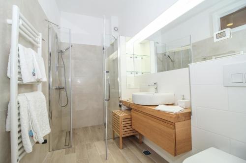 a bathroom with a sink and a shower at Villa Castel in Bale
