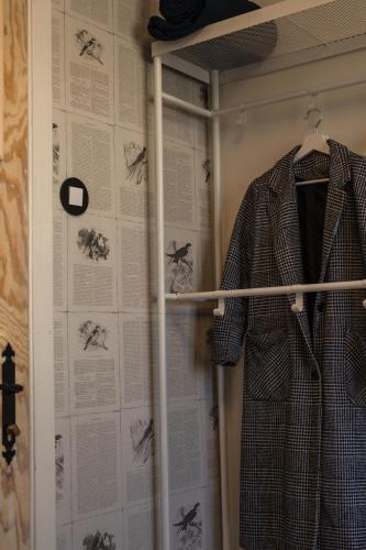 a coat on a hanger in a closet at 5 kroków in Zakopane