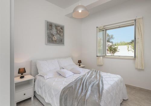 Postelja oz. postelje v sobi nastanitve Adriatic Dream Apartments