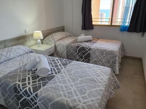 Кровать или кровати в номере Trebol One Apartments By Mc