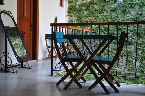 a chair sitting on a porch next to a fence at Sibel Hotel in Antalya