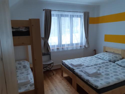 Postel nebo postele na pokoji v ubytování Ubytování pod rozhlednou