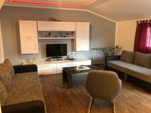 a living room with a couch and a table at Apartment Jopa in Šibenik