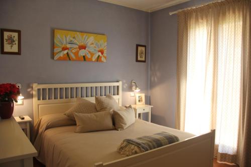 Ένα ή περισσότερα κρεβάτια σε δωμάτιο στο B&B Il Giardino