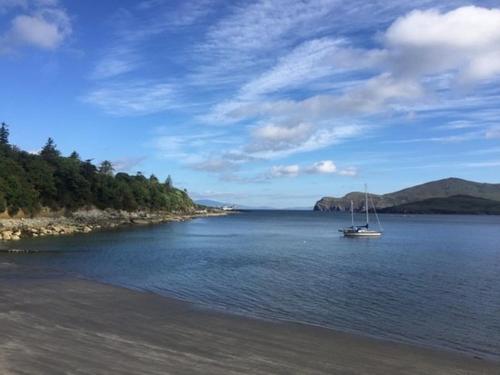 a boat sitting in the middle of a body of water at Foxglove House in Valentia Island