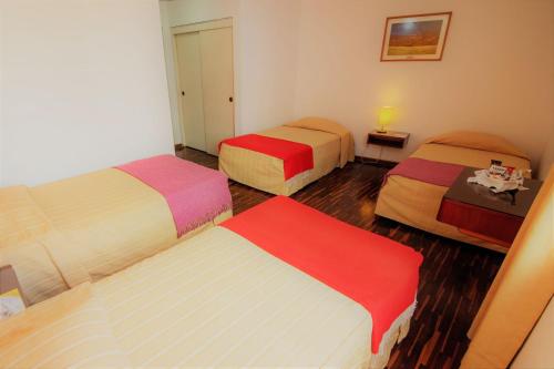 Cama o camas de una habitación en Hotel Chavín