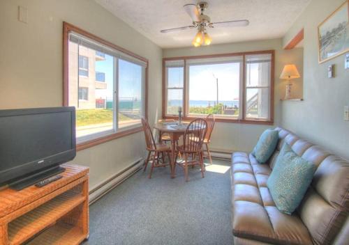 a living room with a couch and a table at The Skylark Beach Inn in Old Orchard Beach
