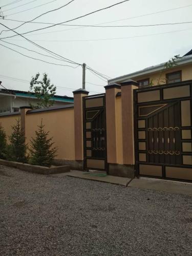 a pair of gates on a house at MEDI Guest House in Osh