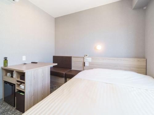Postel nebo postele na pokoji v ubytování Super Hotel Shonan Fujisawaeki Minamiguchi