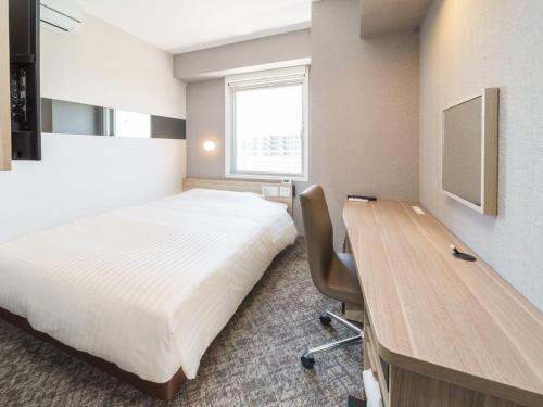 Postel nebo postele na pokoji v ubytování Super Hotel Shonan Fujisawaeki Minamiguchi