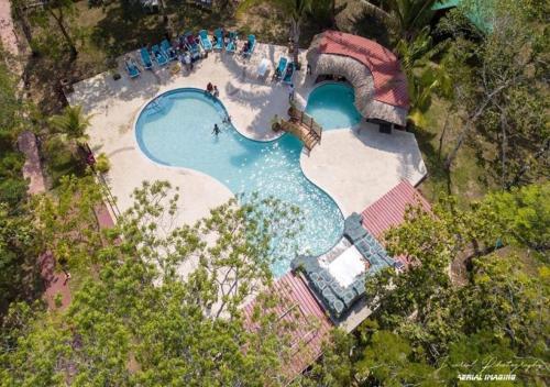 an overhead view of a swimming pool in a resort at KikiWitz Resort in Belmopan