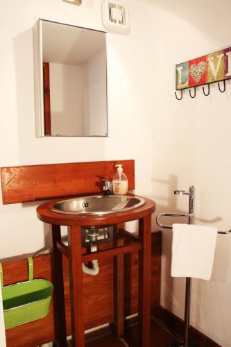 a bathroom with a sink and a mirror at Villa Palma in Maleme