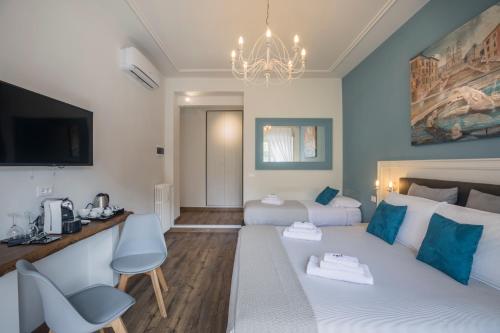 Katil atau katil-katil dalam bilik di Trastevere Gallery Suites