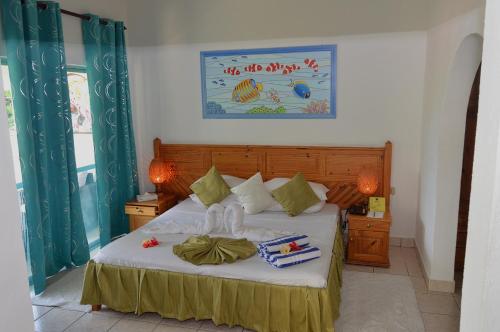 Postel nebo postele na pokoji v ubytování Coco D'or Hotel Seychelles