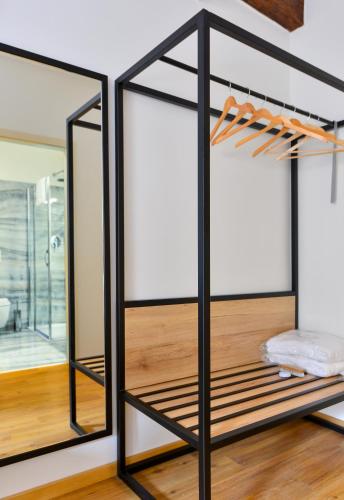 a room with glass dividers in a house at Hotel Garden Court in Prague