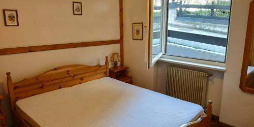 Giường trong phòng chung tại Apartment 18 Federico Bandi Cavalese