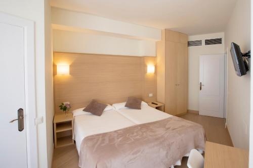 Ένα ή περισσότερα κρεβάτια σε δωμάτιο στο Hotel Ciudad De Calahorra