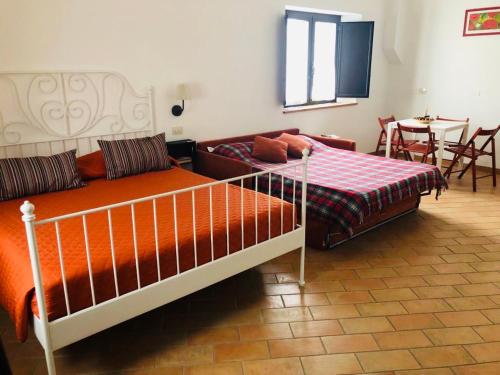 Cama o camas de una habitación en Appartamenti Il Criollo